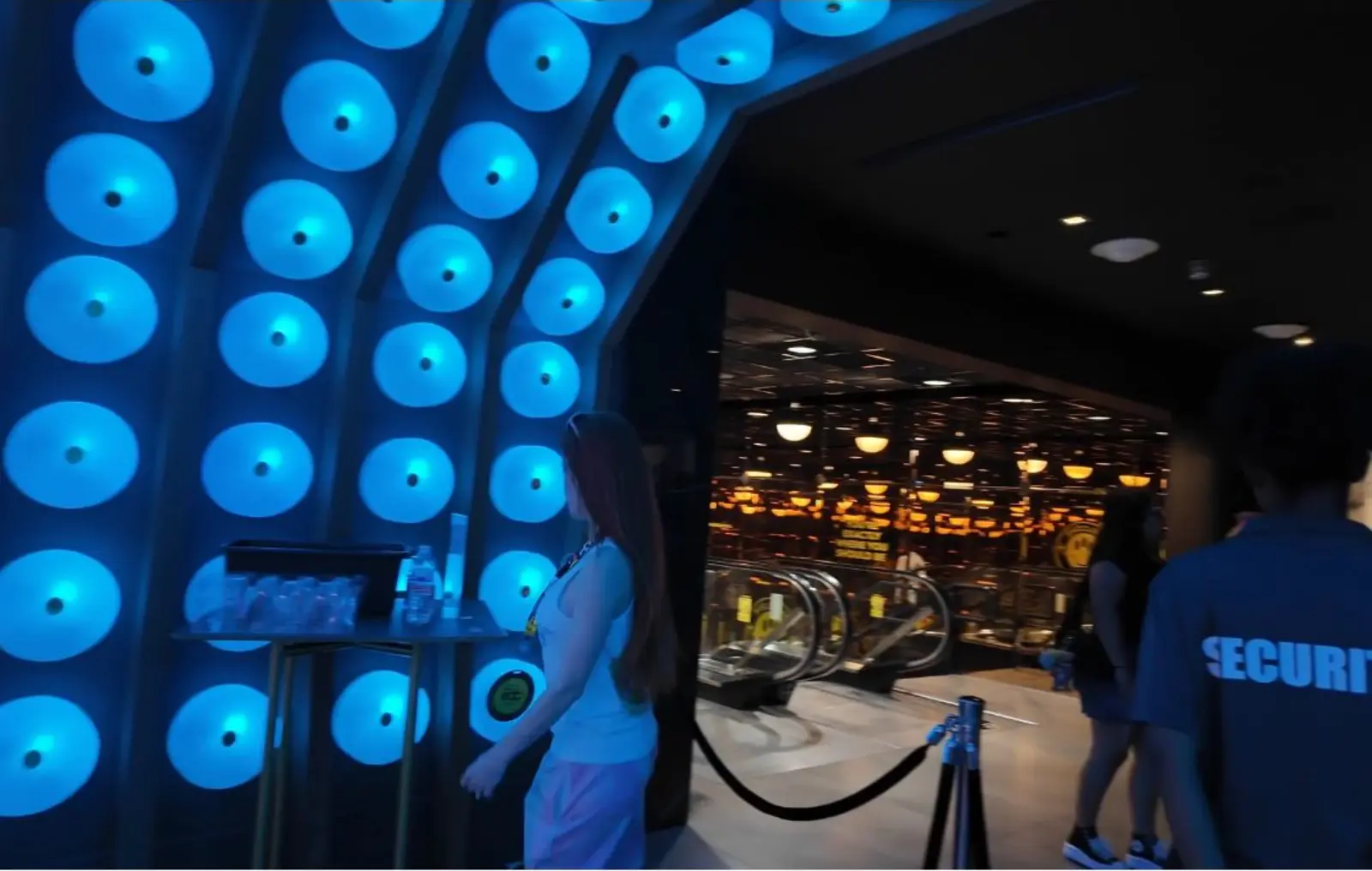 Blue neon entrance at the EDC JellyMed activation